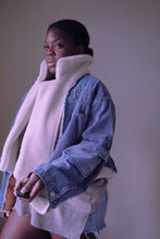 Load image into Gallery viewer, The Big Sky Jacket is the ideal rugged-chic statement piece for any fashionista. This denim jacket features unique fringe seams, as well as a stunning cut-out in the back lined with rich suede faux fabric. For extra comfort and coziness while wearing it, this jacket is lined with sherpa  lining to provide maximum warmth.